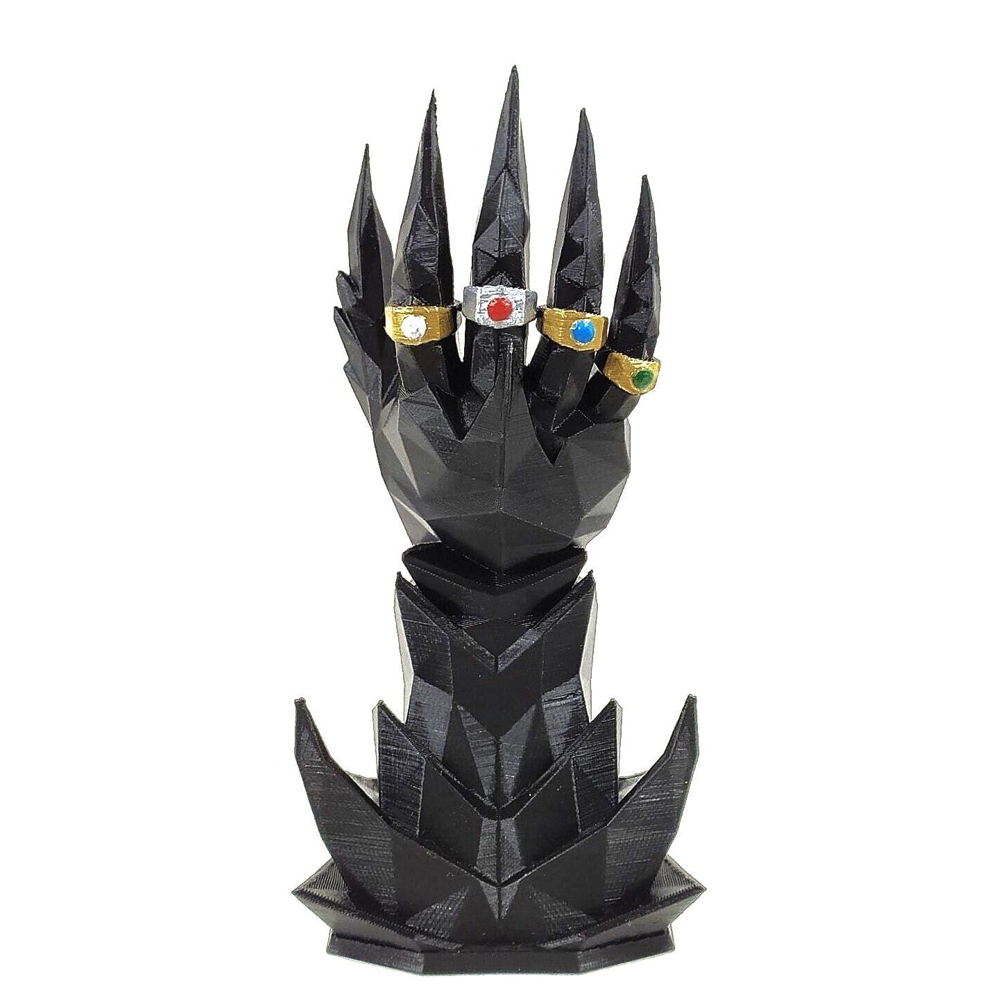 Black dragon scale-like design with colorful gemstones on a white background