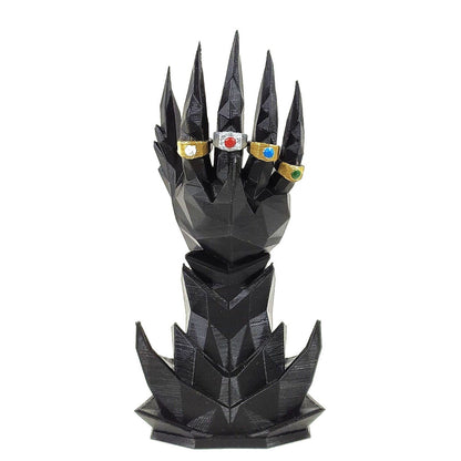 Black dragon scale-like design with colorful gemstones on a white background