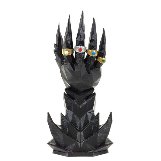 Black dragon scale-like design with colorful gemstones on a white background