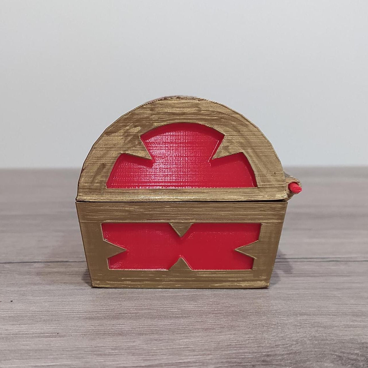 Wooden box with red interior on a wooden surface